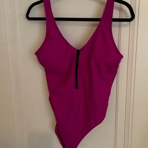 Never worn before one piece swim suit